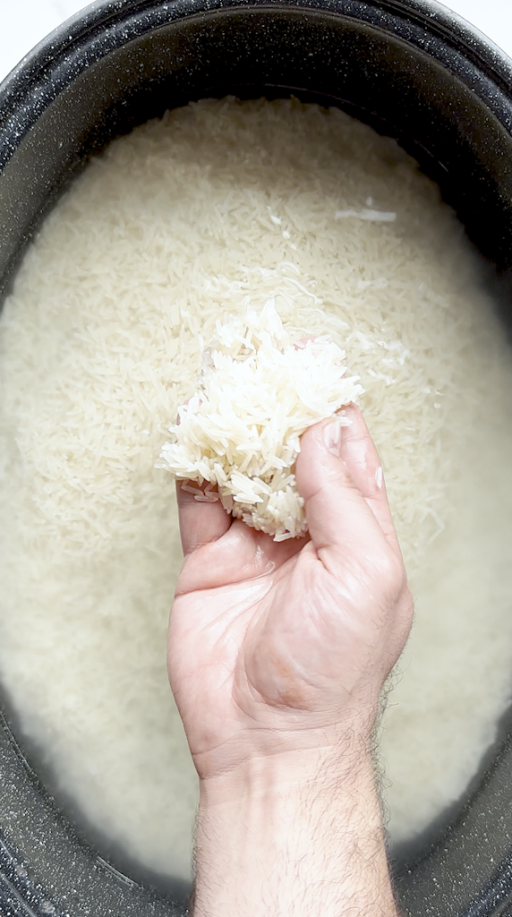 basket rice being soaked prior to boiling